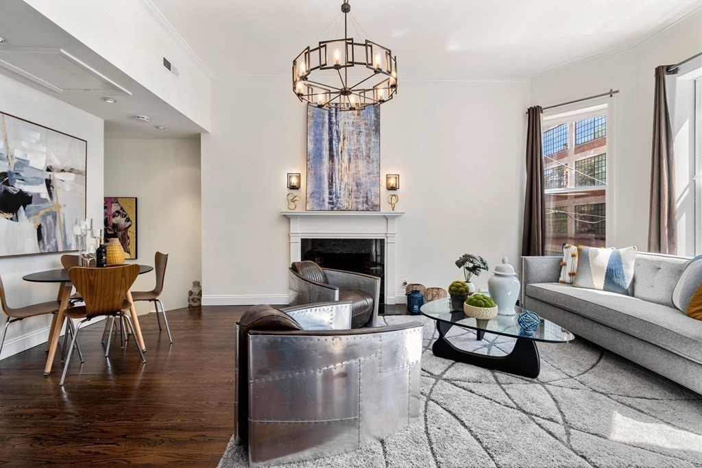 352 Commonwealth Avenue, Unit 2 Boston, MA 02115 - Photo 2 of 25 a living room with fireplace furniture and a chandelier