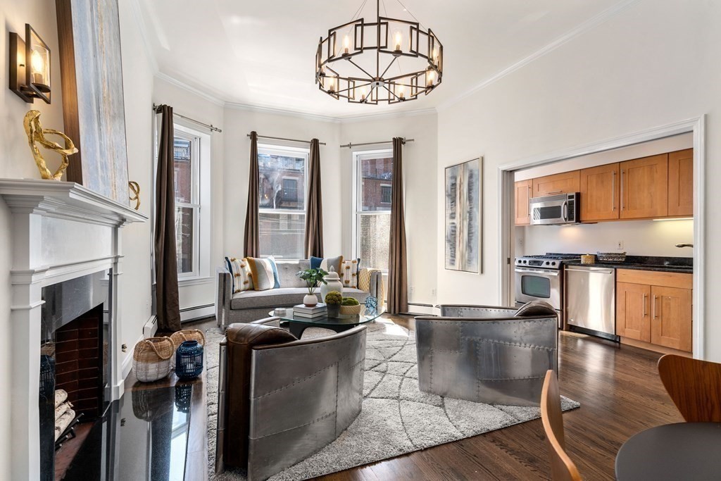 352 Commonwealth Avenue, Unit 2 Boston, MA 02115 - Photo 3 of 25 a living room with fireplace furniture and a flat screen tv
