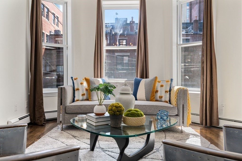352 Commonwealth Avenue, Unit 2 Boston, MA 02115 - Photo 4 of 25 a living room with furniture and a potted plant