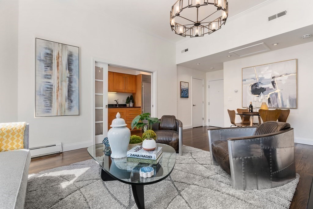 352 Commonwealth Avenue, Unit 2 Boston, MA 02115 - Photo 9 of 25 a living room with fireplace furniture and a window