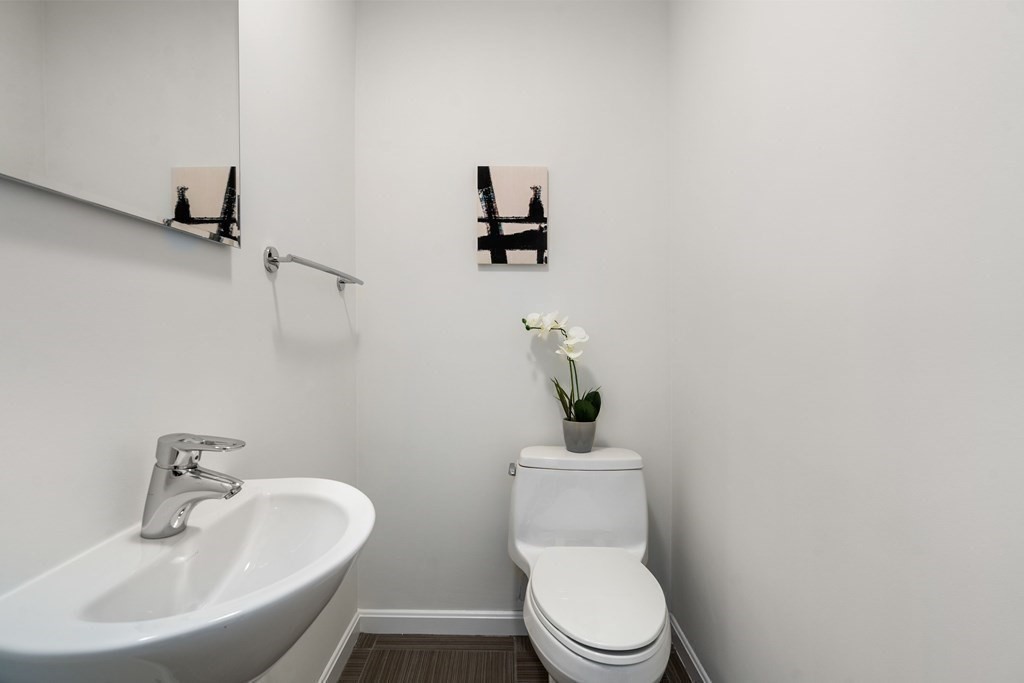 352 Commonwealth Avenue, Unit 2 Boston, MA 02115 - Photo 10 of 25 a bathroom with a toilet sink and mirror