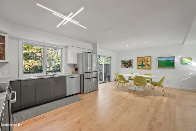 a large kitchen with a table and chairs in it
