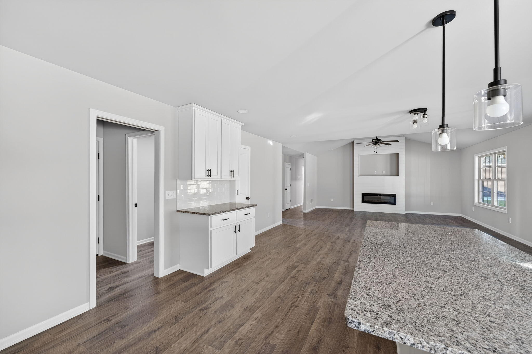 1611 Elderberry Street Southeast De Motte, IN 46310 - Photo 18 of 31 a view of a kitchen and a sink wooden floor windows