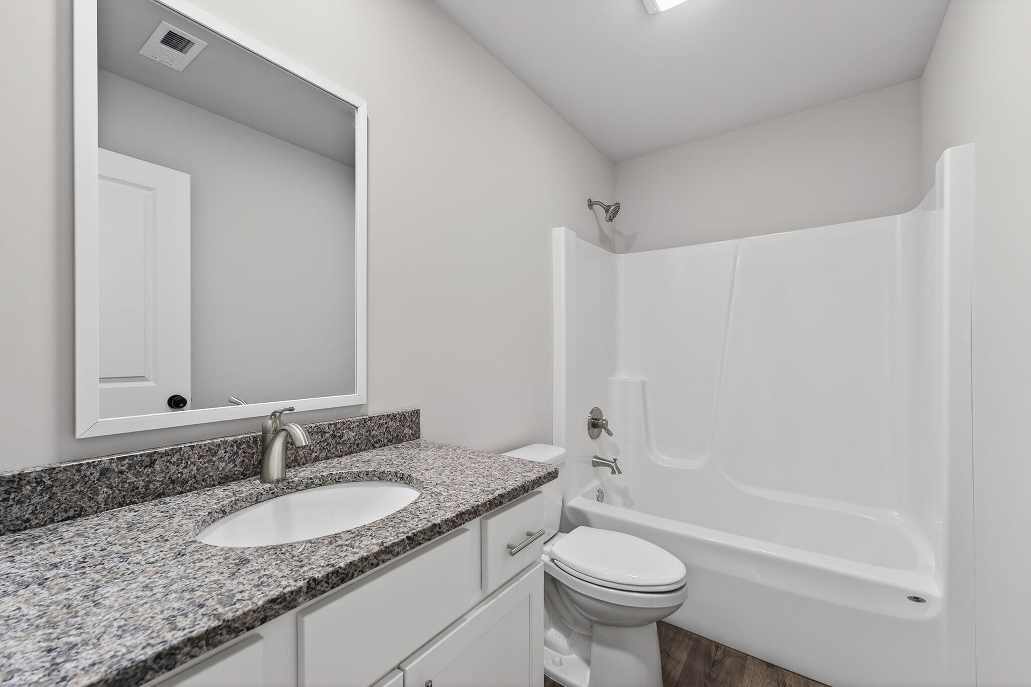 1611 Elderberry Street Southeast De Motte, IN 46310 - Photo 19 of 31 a bathroom with a granite countertop sink toilet and shower