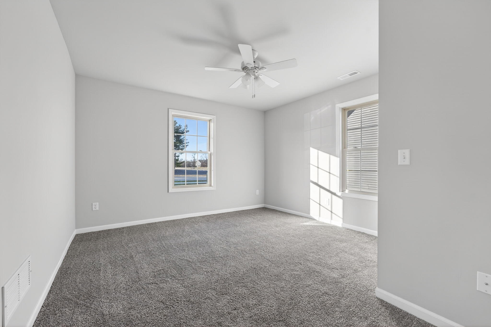 1611 Elderberry Street Southeast De Motte, IN 46310 - Photo 21 of 31 an empty room with windows and fan