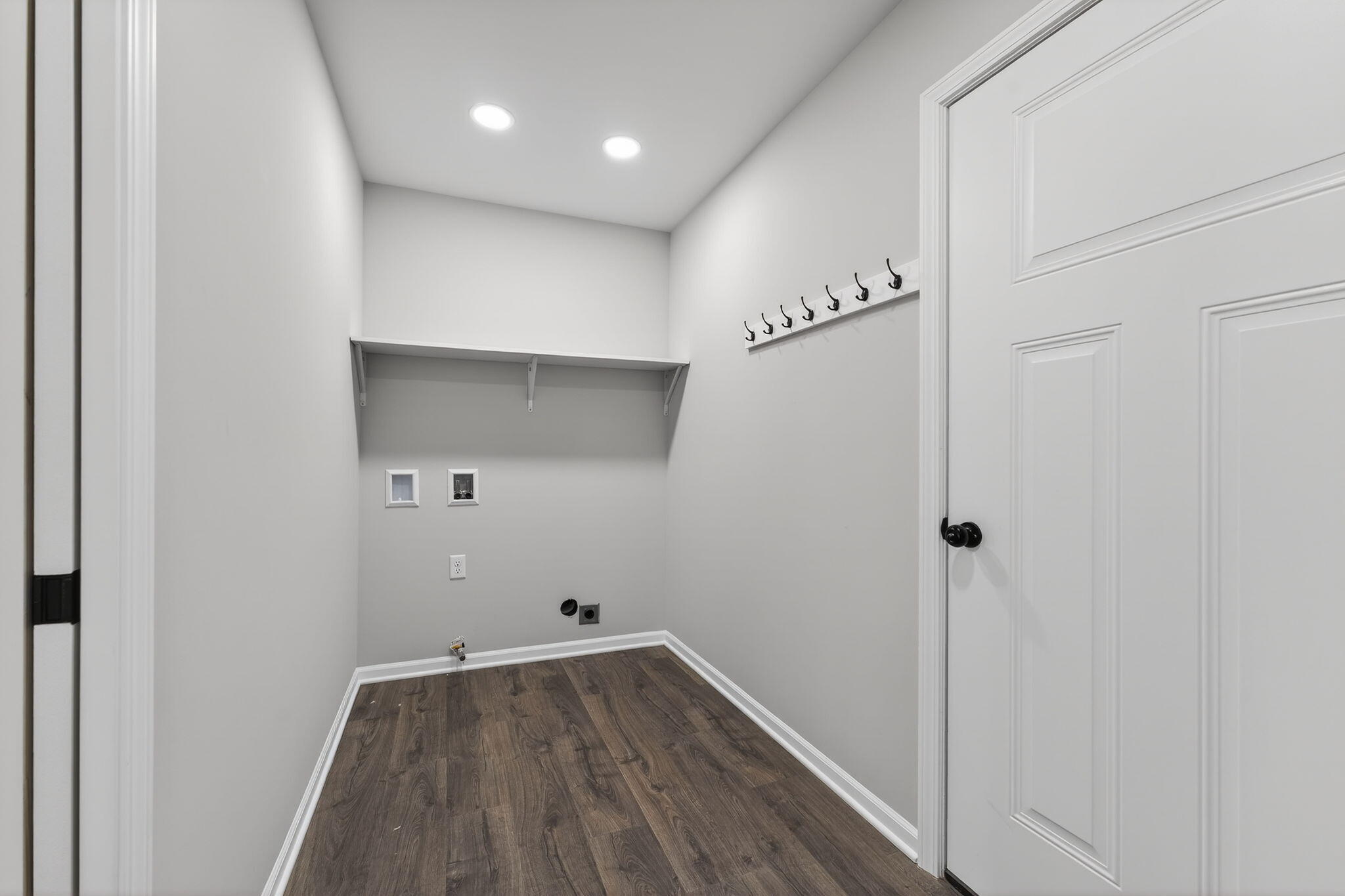 1611 Elderberry Street Southeast De Motte, IN 46310 - Photo 26 of 31 a view of a hallway to a room with wooden floor