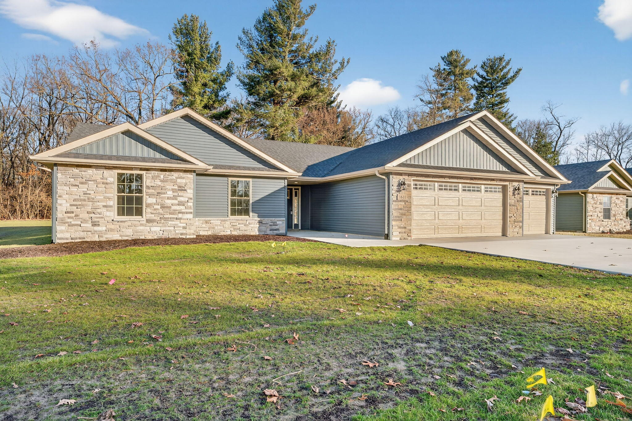 1611 Elderberry Street Southeast De Motte, IN 46310 - Photo 4 of 31 a front view of a house with a garden