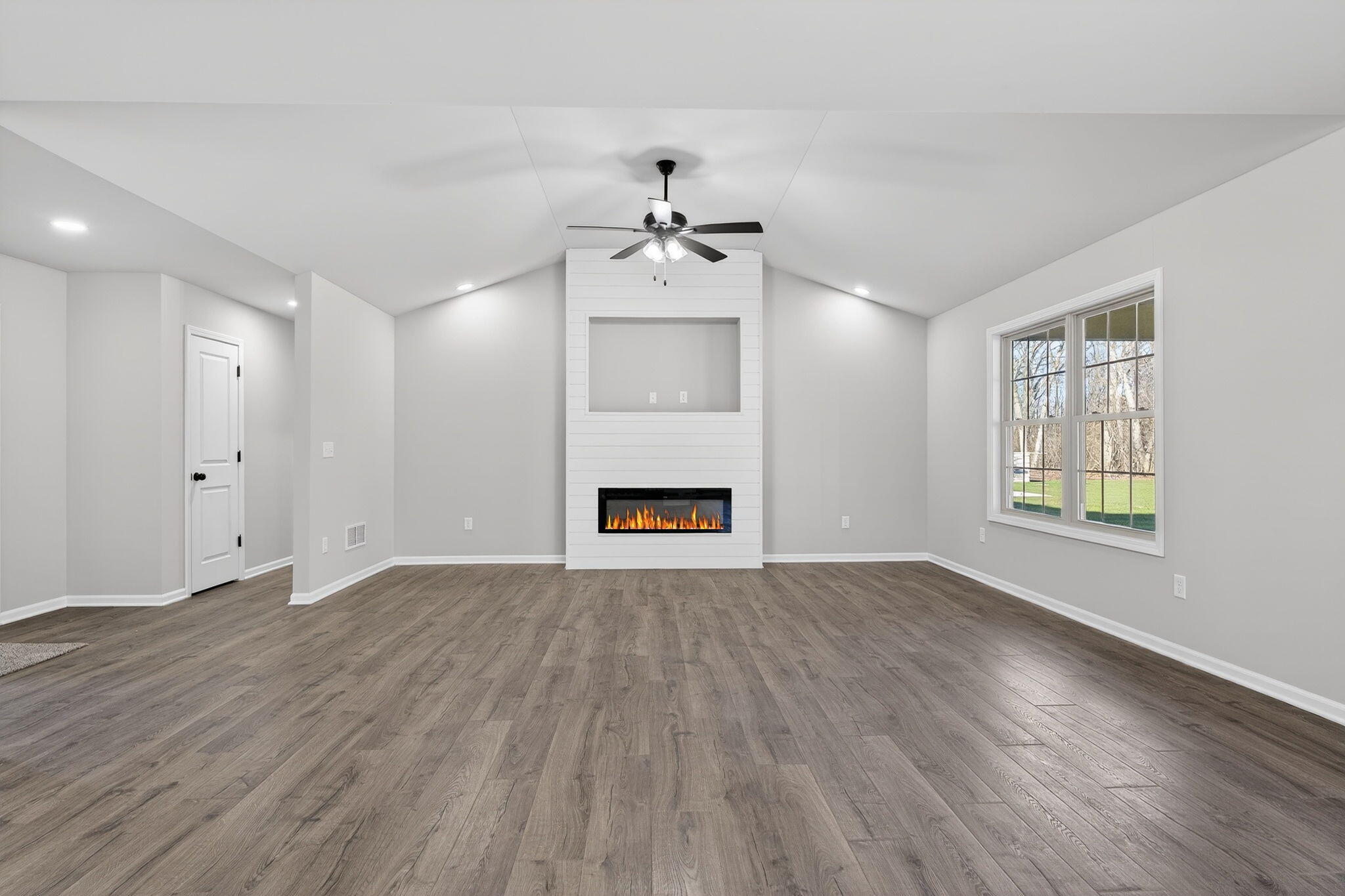 1611 Elderberry Street Southeast De Motte, IN 46310 - Photo 8 of 31 wooden floor in an empty room with a window