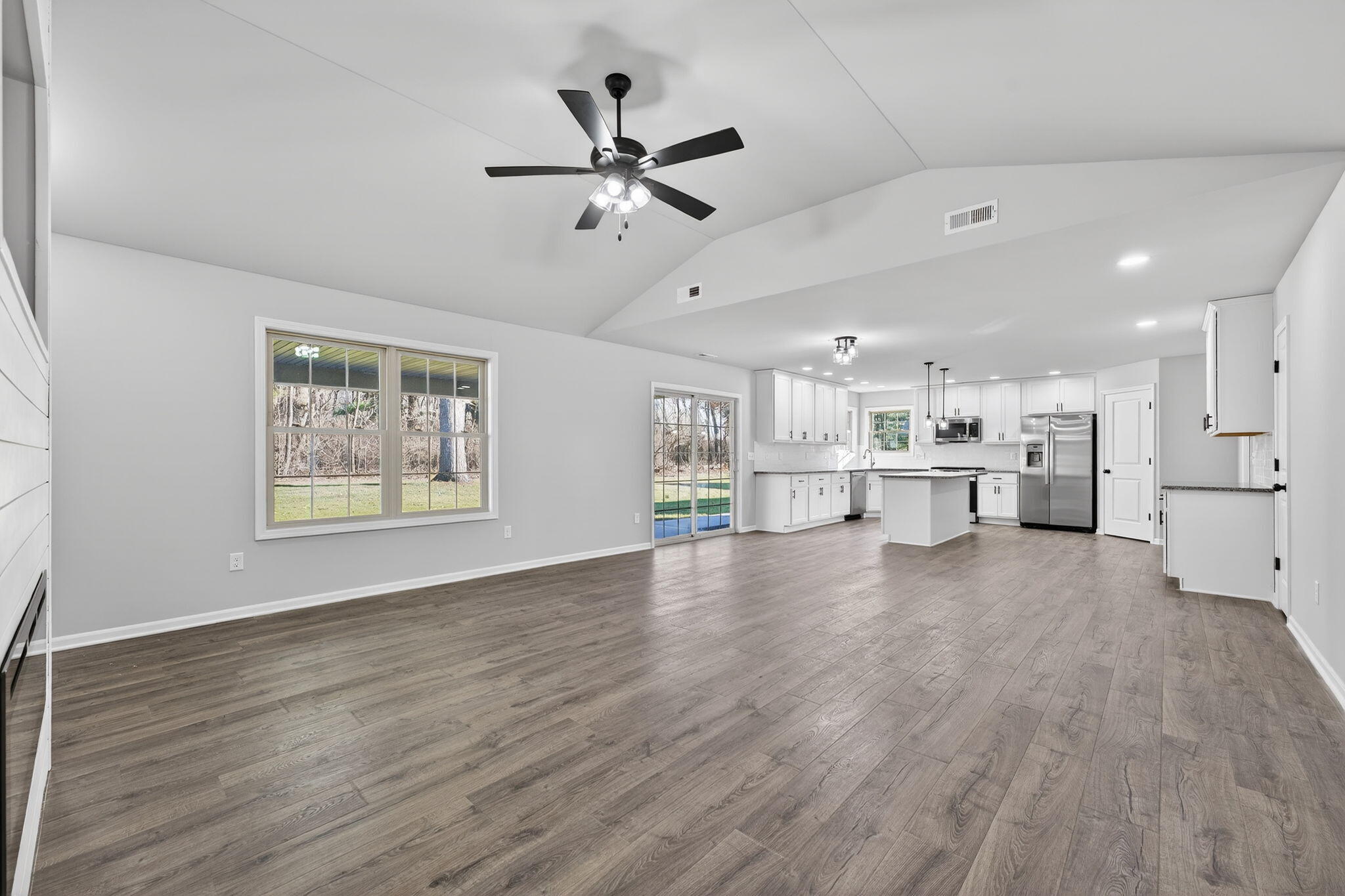 1611 Elderberry Street Southeast De Motte, IN 46310 - Photo 9 of 31 a view of an empty room with a window and wooden floor
