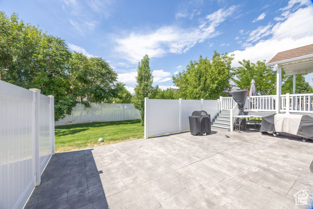 2280 South 450 West Perry, UT 84302 - Photo 35 of 38 Fenced backyard with a grill and a patio