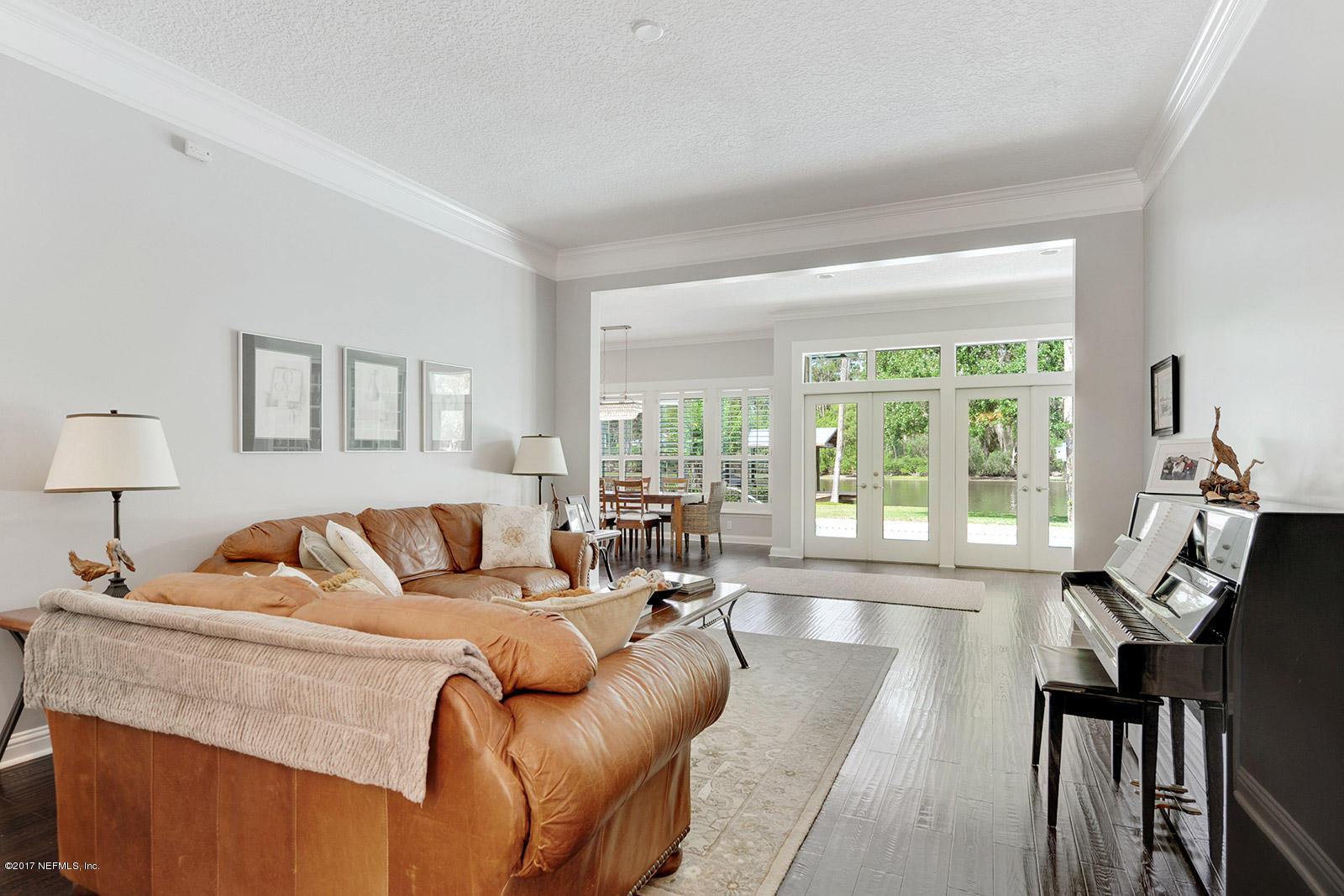 51 Cat Road Ponte Vedra Beach, FL 32082 - Photo 6 of 37 a living room with furniture and a large window