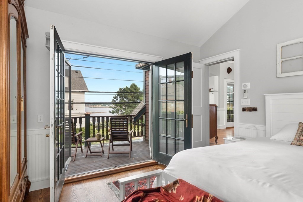 46 Granite Street, Unit DWINTER Rockport, MA 01966 - Photo 13 of 23 a bedroom with furniture and a window