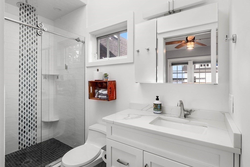46 Granite Street, Unit DWINTER Rockport, MA 01966 - Photo 15 of 23 a bathroom with a sink toilet and shower