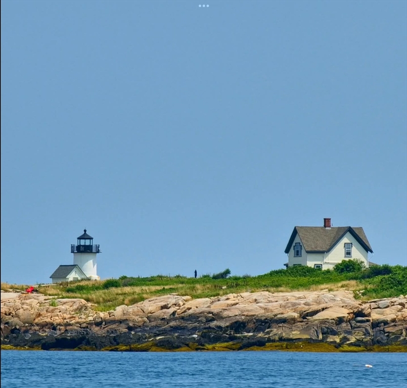 46 Granite Street, Unit DWINTER Rockport, MA 01966 - Photo 3 of 23 a view of a room with wooden floor