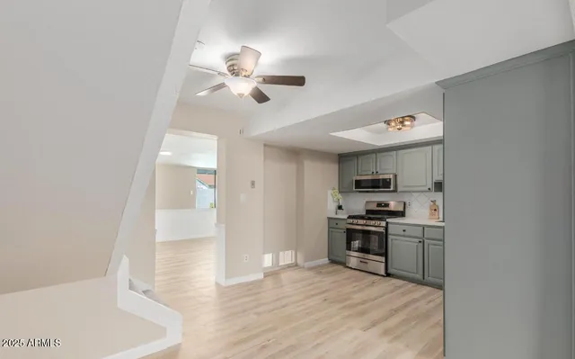 a view of a kitchen with a sink dishwasher oven and a refrigerator