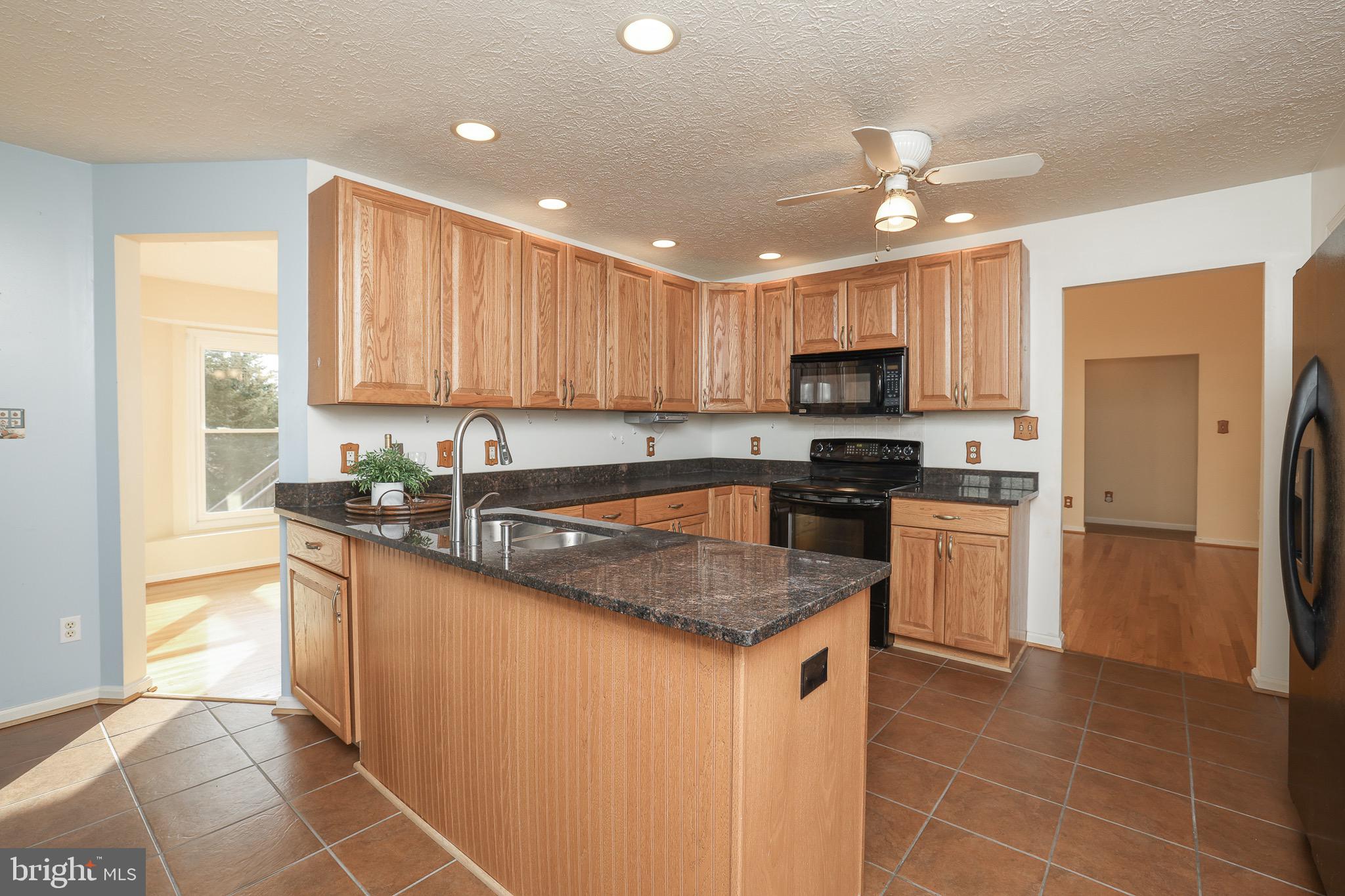 121 Canyon Road Winchester, VA 22602 - Photo 14 of 35 Recessed lighting illuminates the open kitchen
