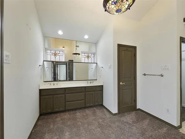 a view of kitchen with stainless steel appliances granite countertop a refrigerator and a sink