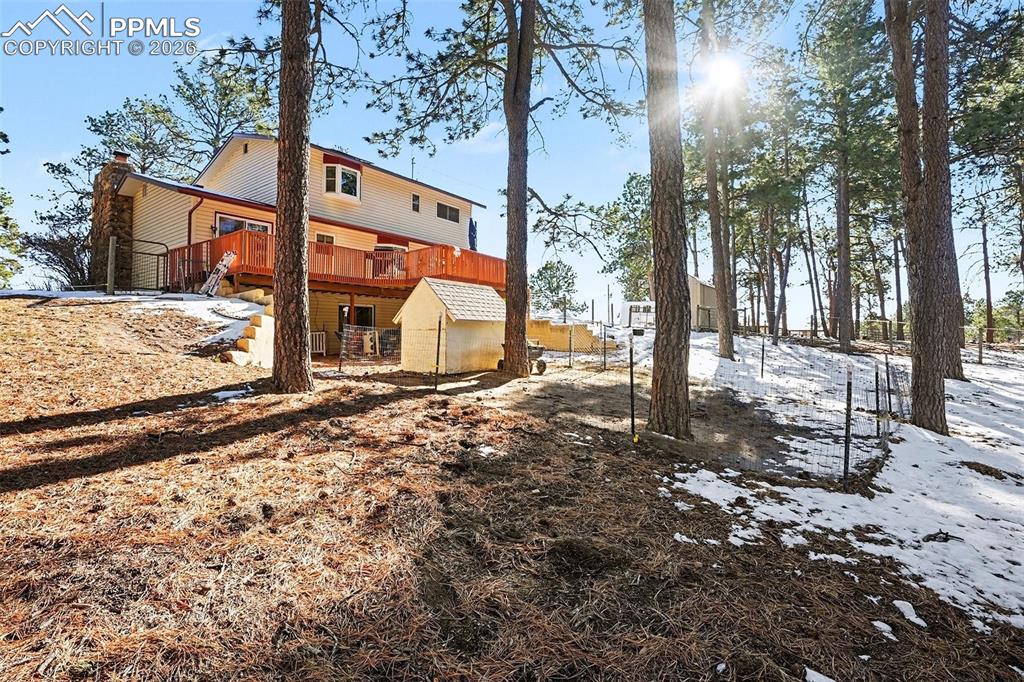 8265 Tannenbaum Road Colorado Springs, CO 80908 - Photo 29 of 50 a view of a house with a yard covered in snow