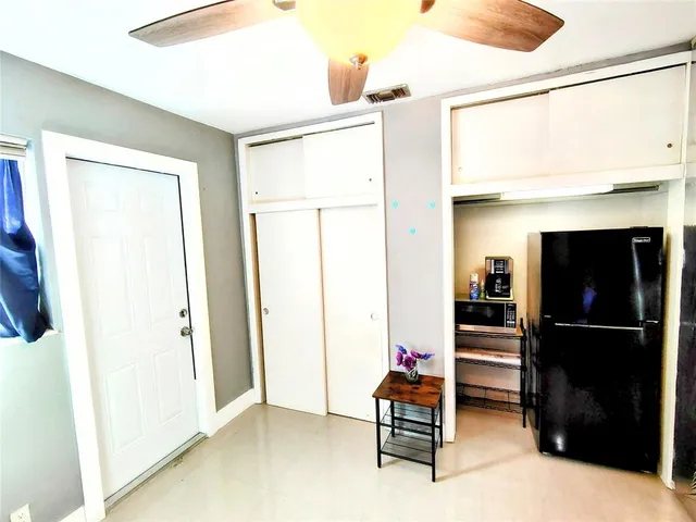 a view of living room with furniture and a flat screen tv