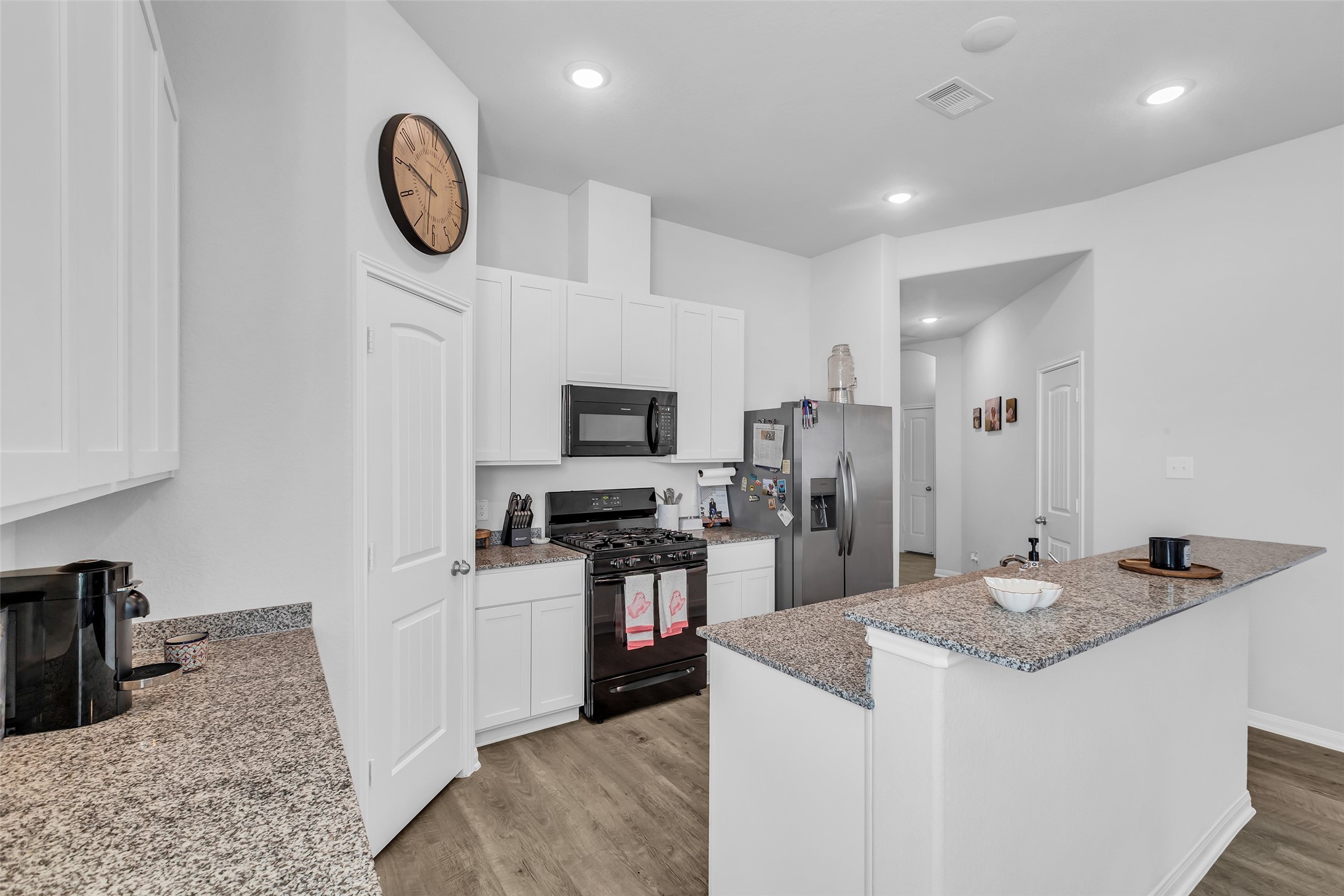 Kitchen highlights include sleek granite countertops and plenty of workspace for all your culinary needs.