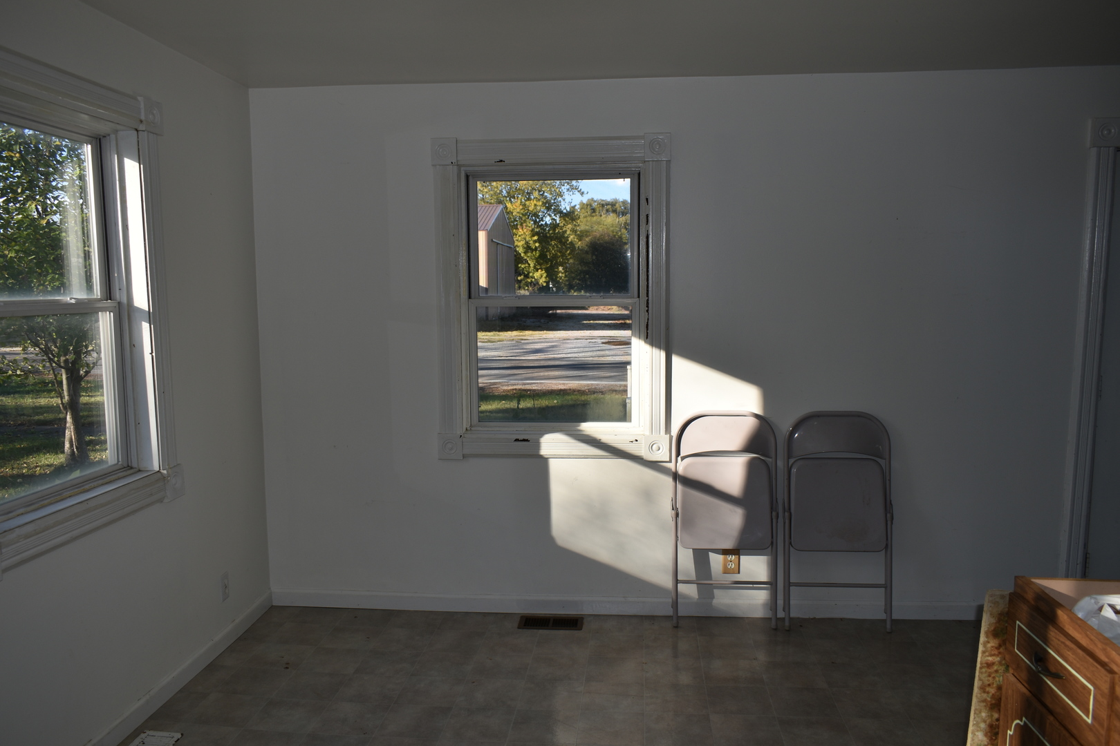 208 East Washington Street Dana, IL 61321 - Photo 11 of 28 a room with a chair and a window