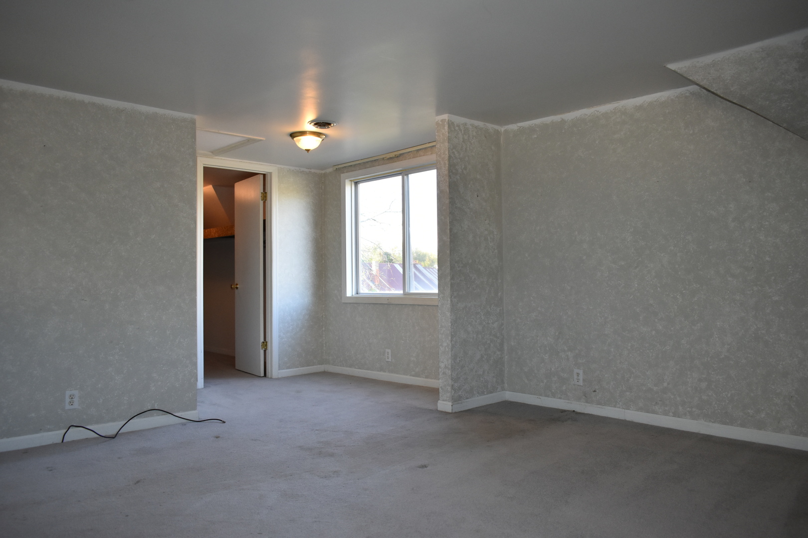 208 East Washington Street Dana, IL 61321 - Photo 18 of 28 an empty room with windows and fan