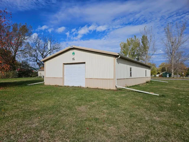 a view of a backyard of the house