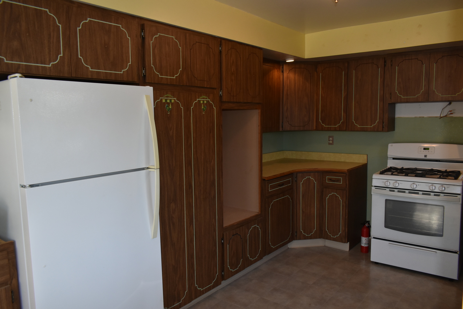 208 East Washington Street Dana, IL 61321 - Photo 8 of 28 a kitchen with stainless steel appliances granite countertop a refrigerator and a stove top oven