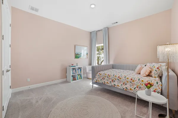 a bathroom with a double vanity sink a mirror and a bathtub