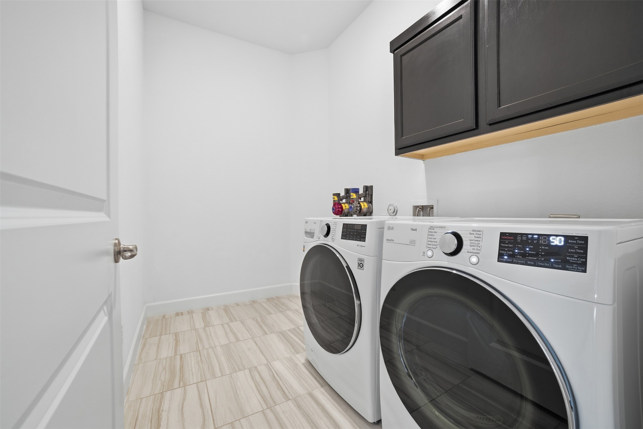 256 Smoke Tree Circle Dripping Springs, TX 78620 - Photo 30 of 40 a utility room with dryer and washer