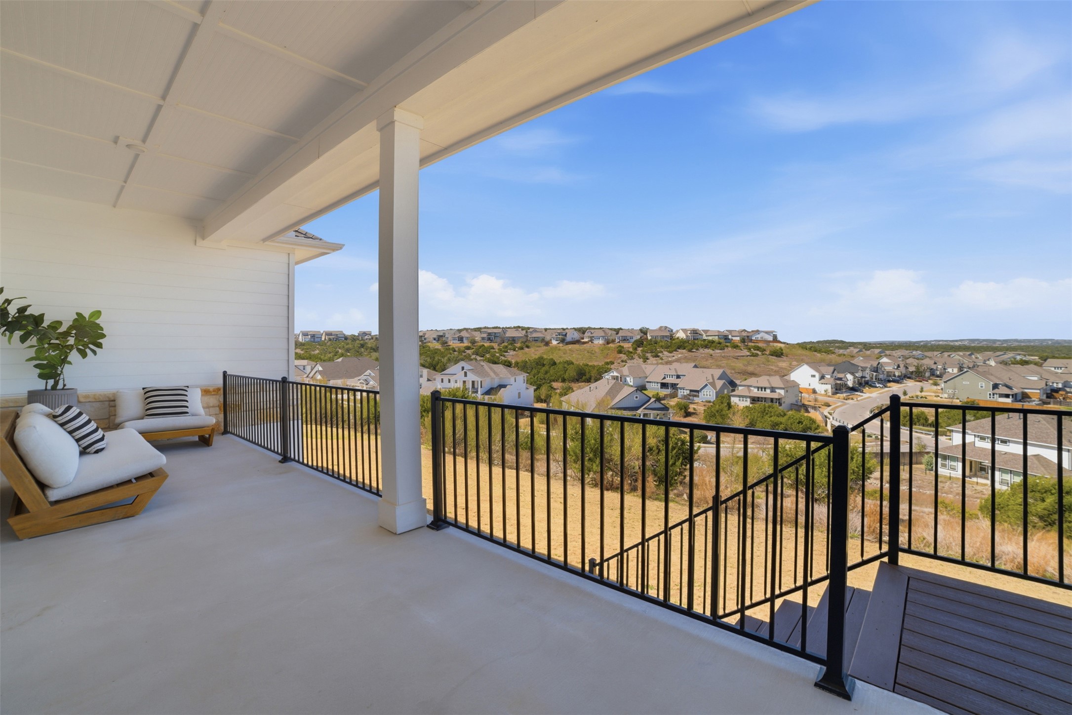 256 Smoke Tree Circle Dripping Springs, TX 78620 - Photo 33 of 40 a view of a balcony with furniture