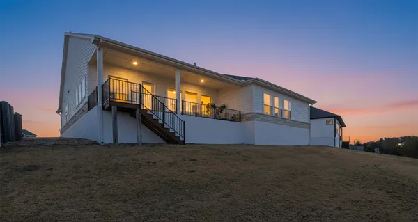 a view of a balcony with furniture