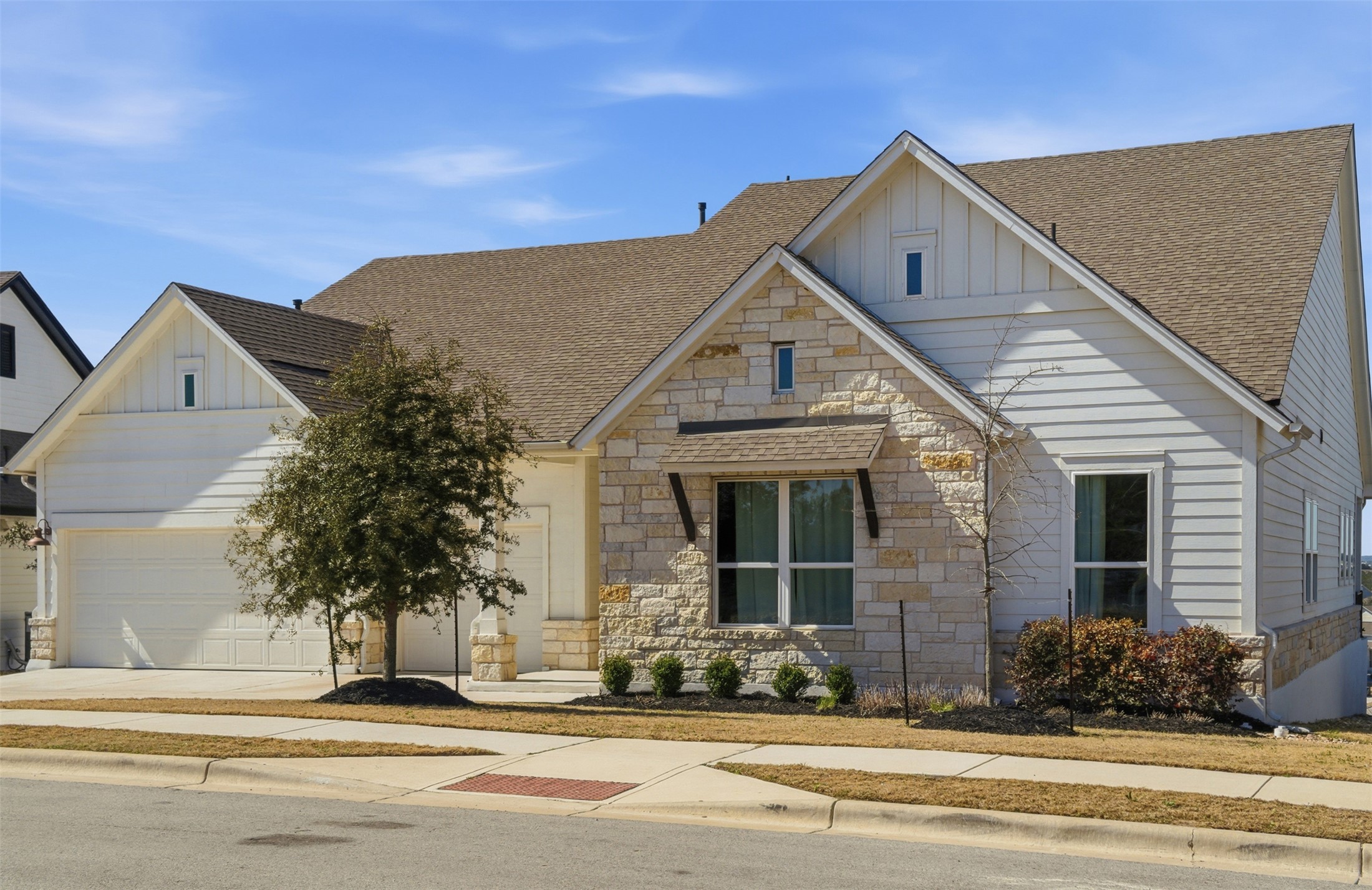 256 Smoke Tree Circle Dripping Springs, TX 78620 - Photo 4 of 40 a front view of a house with a yard