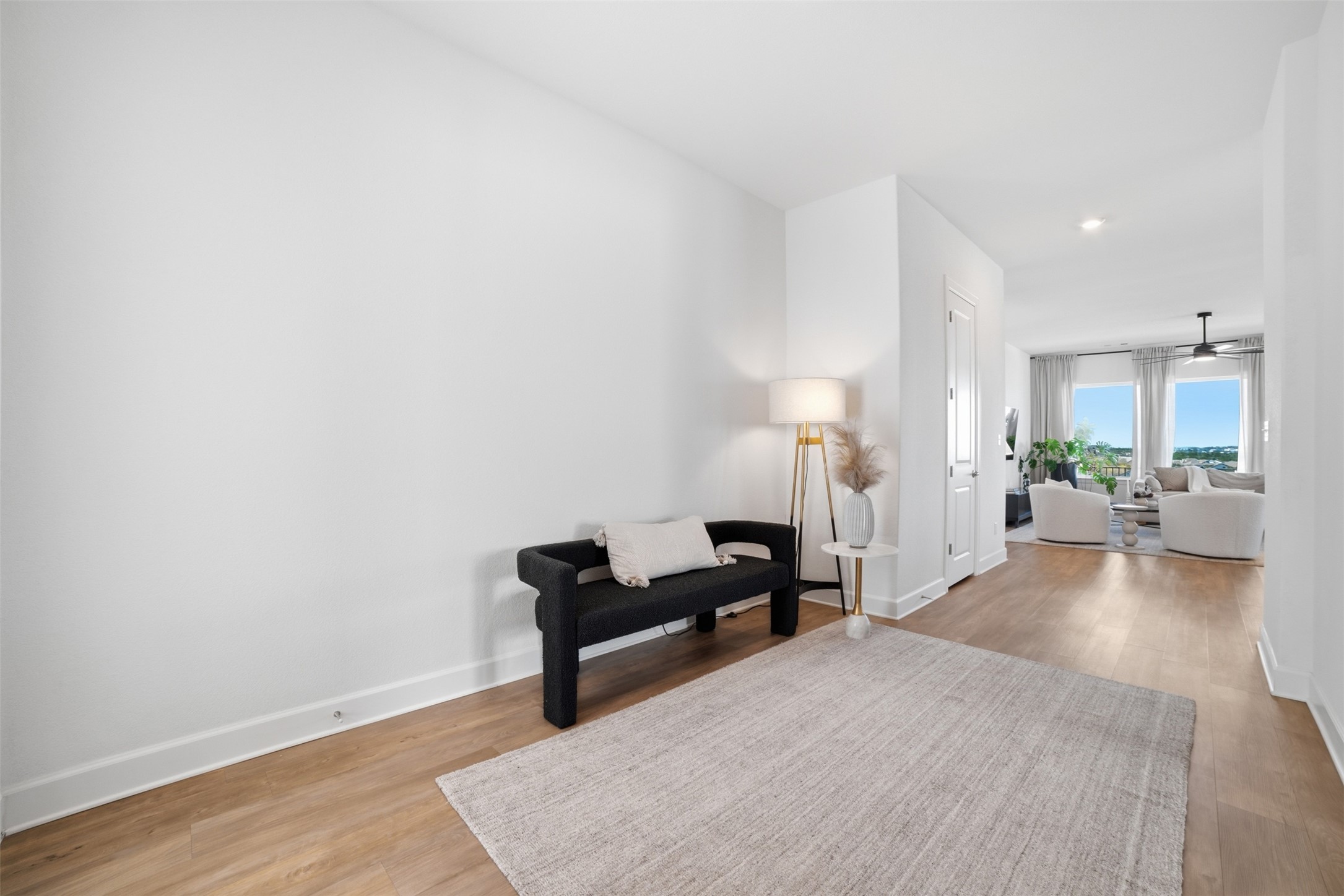 256 Smoke Tree Circle Dripping Springs, TX 78620 - Photo 6 of 40 a living room with furniture and a wooden floor