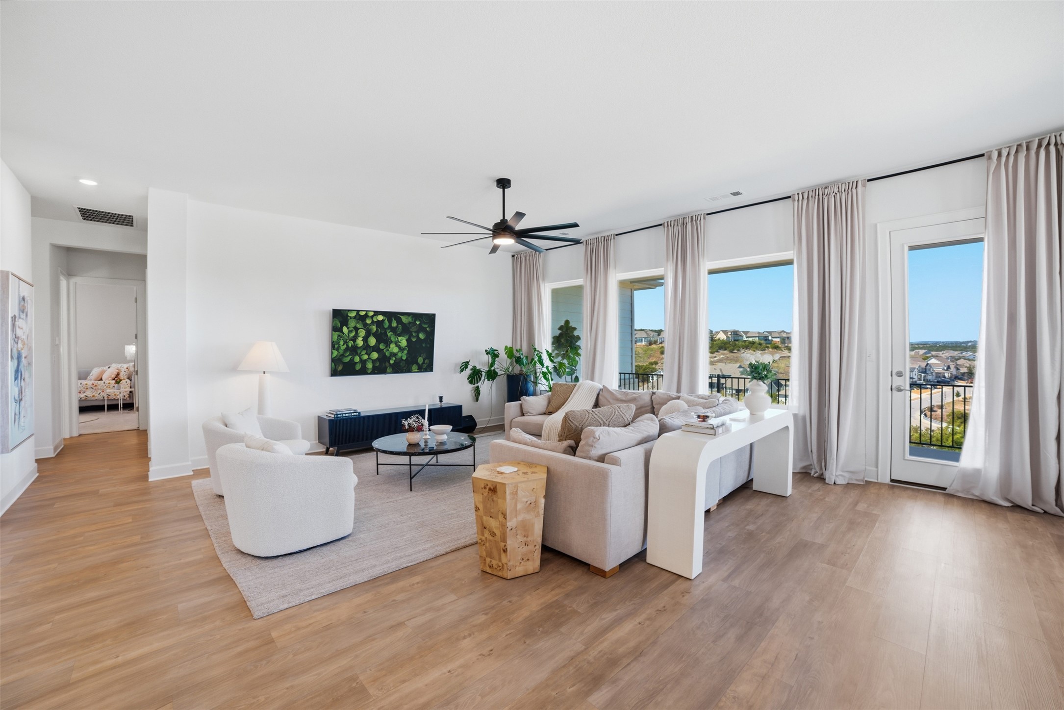 256 Smoke Tree Circle Dripping Springs, TX 78620 - Photo 7 of 40 a living room with furniture and a flat screen tv