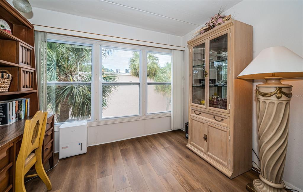 920 Virginia Street, Unit 302 Dunedin, FL 34698 - Photo 18 of 66 a view of a livingroom with furniture and staircase