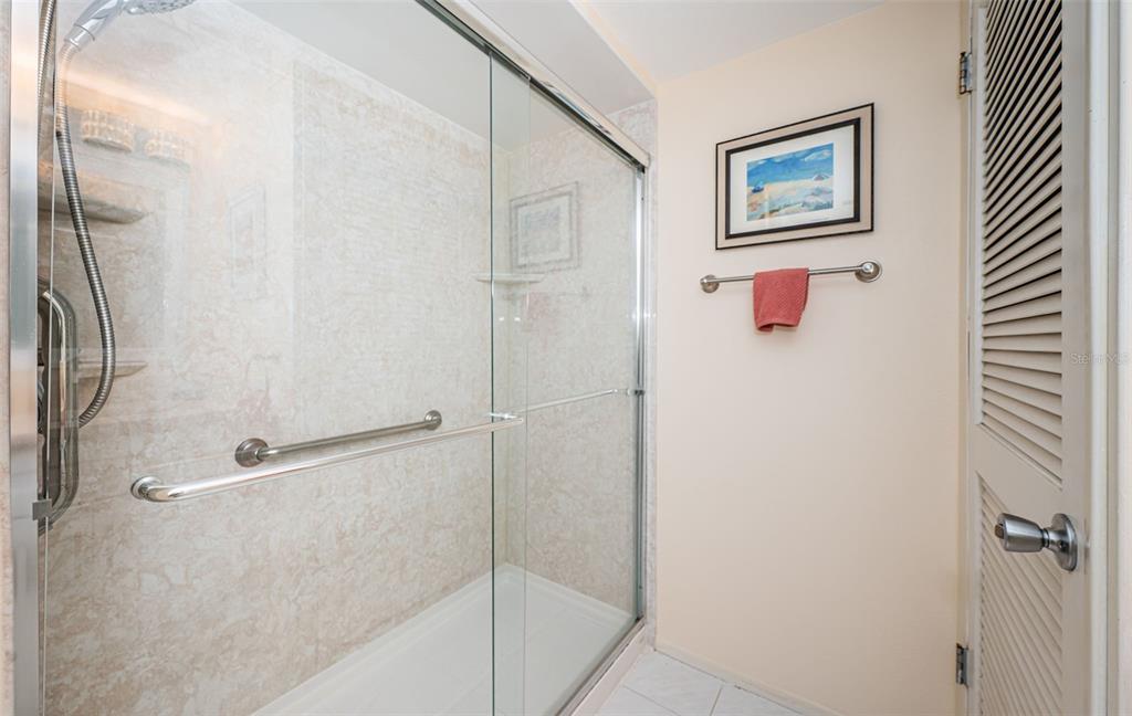 920 Virginia Street, Unit 302 Dunedin, FL 34698 - Photo 32 of 66 a bathroom with a shower and a shower