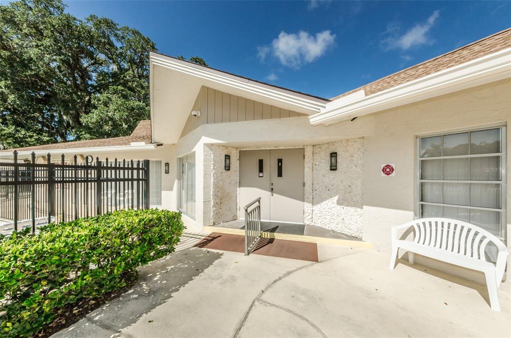 920 Virginia Street, Unit 302 Dunedin, FL 34698 - Photo 52 of 66 a view of a patio with couches table and chairs and potted plants