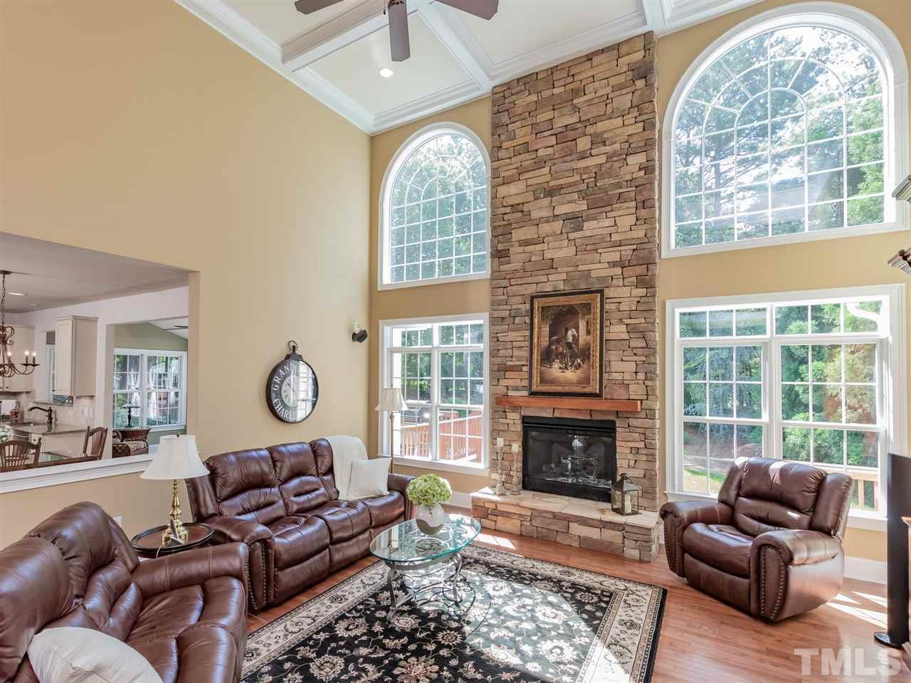 4717 Haleytree Court Raleigh, NC 27606 - Photo 8 of 30 The stunning fireplace is the focal point to this beautiful space! Enjoy the audio system!