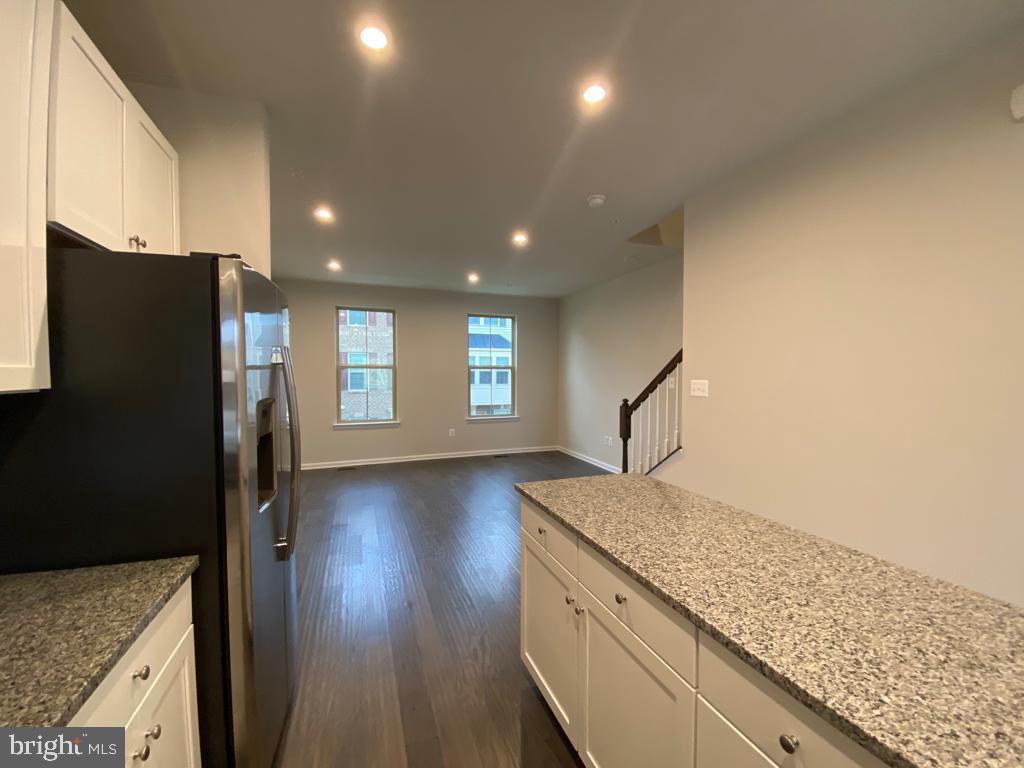 3102 Potters Hill Road Hanover, MD 21076 - Photo 8 of 28 a view of kitchen and hall with wooden floor