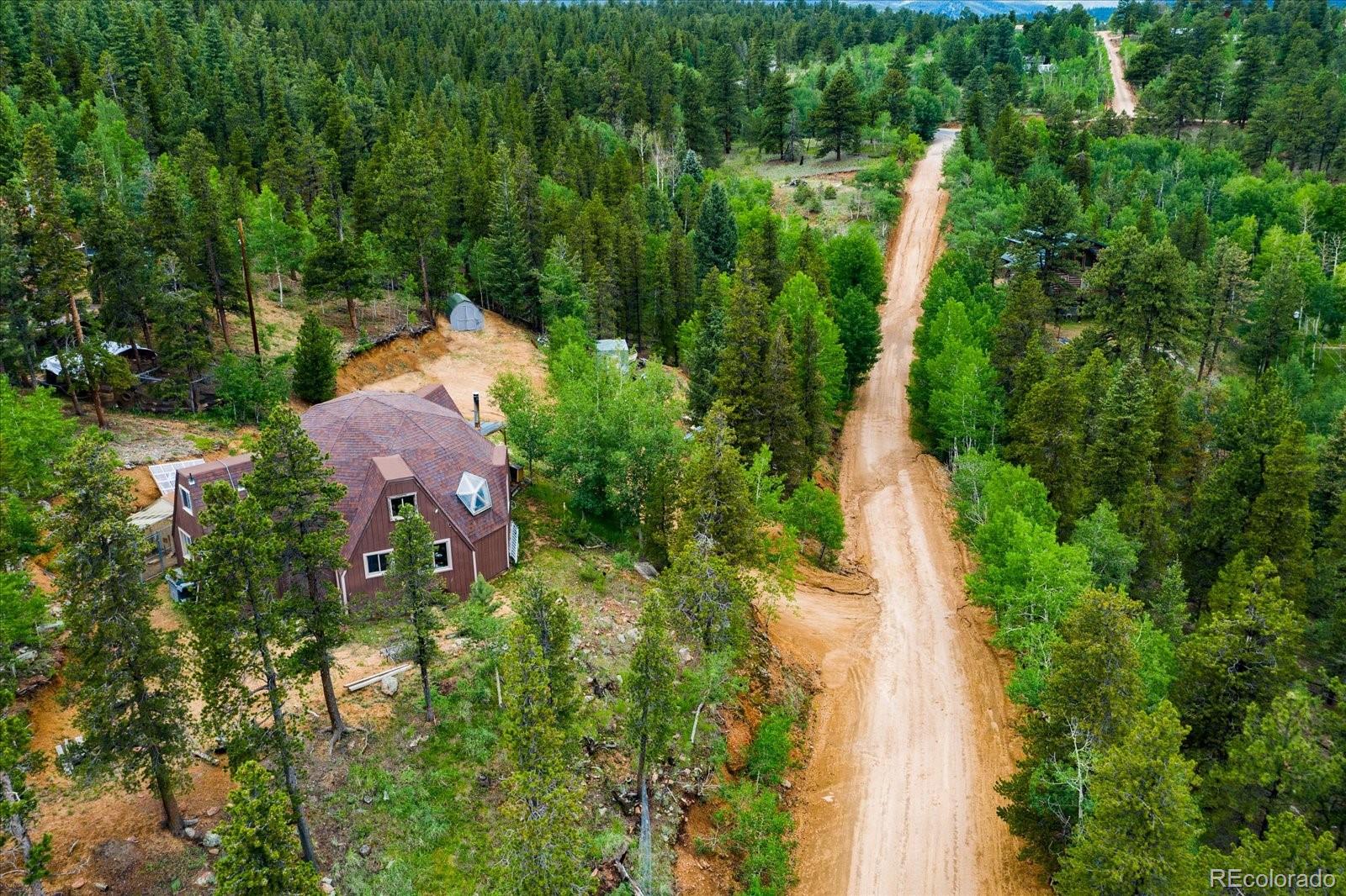 136 Lakeview Road Bailey, CO 80421 - Photo 3 of 40 an aerial view of residential house with outdoor space and trees all around