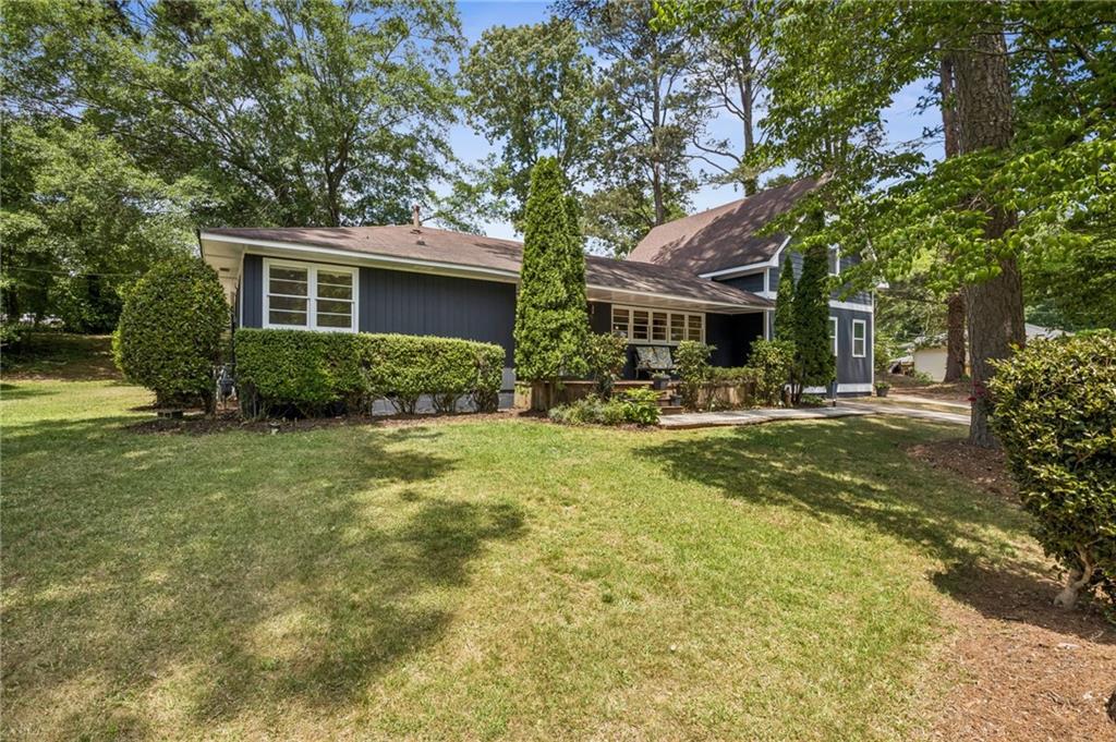 358 Peevy Street Buford, GA 30518 - Photo 2 of 18 a front view of house with yard and green space