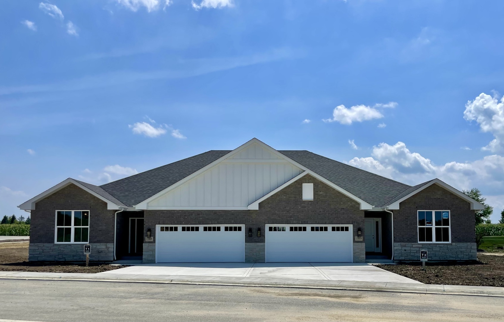 15960 Prairie View, Unit T10 Lockport, IL 60441 - Photo 1 of 29 a front view of a house with a garden