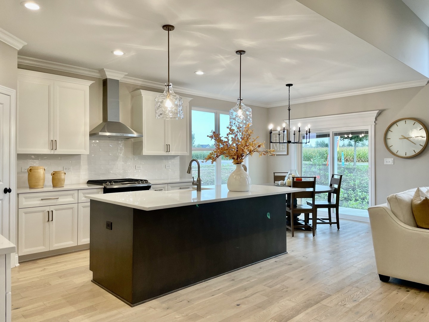 15960 Prairie View, Unit T10 Lockport, IL 60441 - Photo 7 of 29 a kitchen with stainless steel appliances granite countertop a stove a sink dishwasher a refrigerator and a dining table with wooden floor