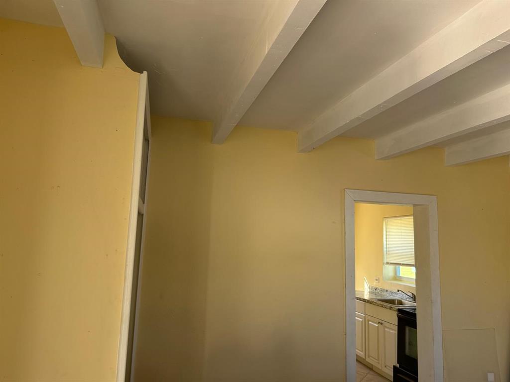 371 Banyan Avenue Pahokee, FL 33476 - Photo 11 of 12 a bathroom with a sink and a mirror