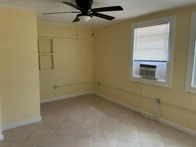 a view of a small space with a fan