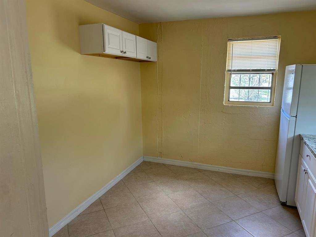 371 Banyan Avenue Pahokee, FL 33476 - Photo 5 of 12 a view of a room with a empty space