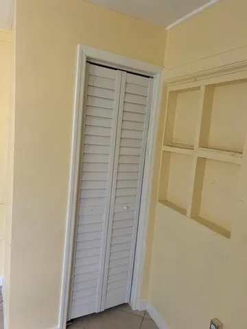 a view of front door with wooden floor