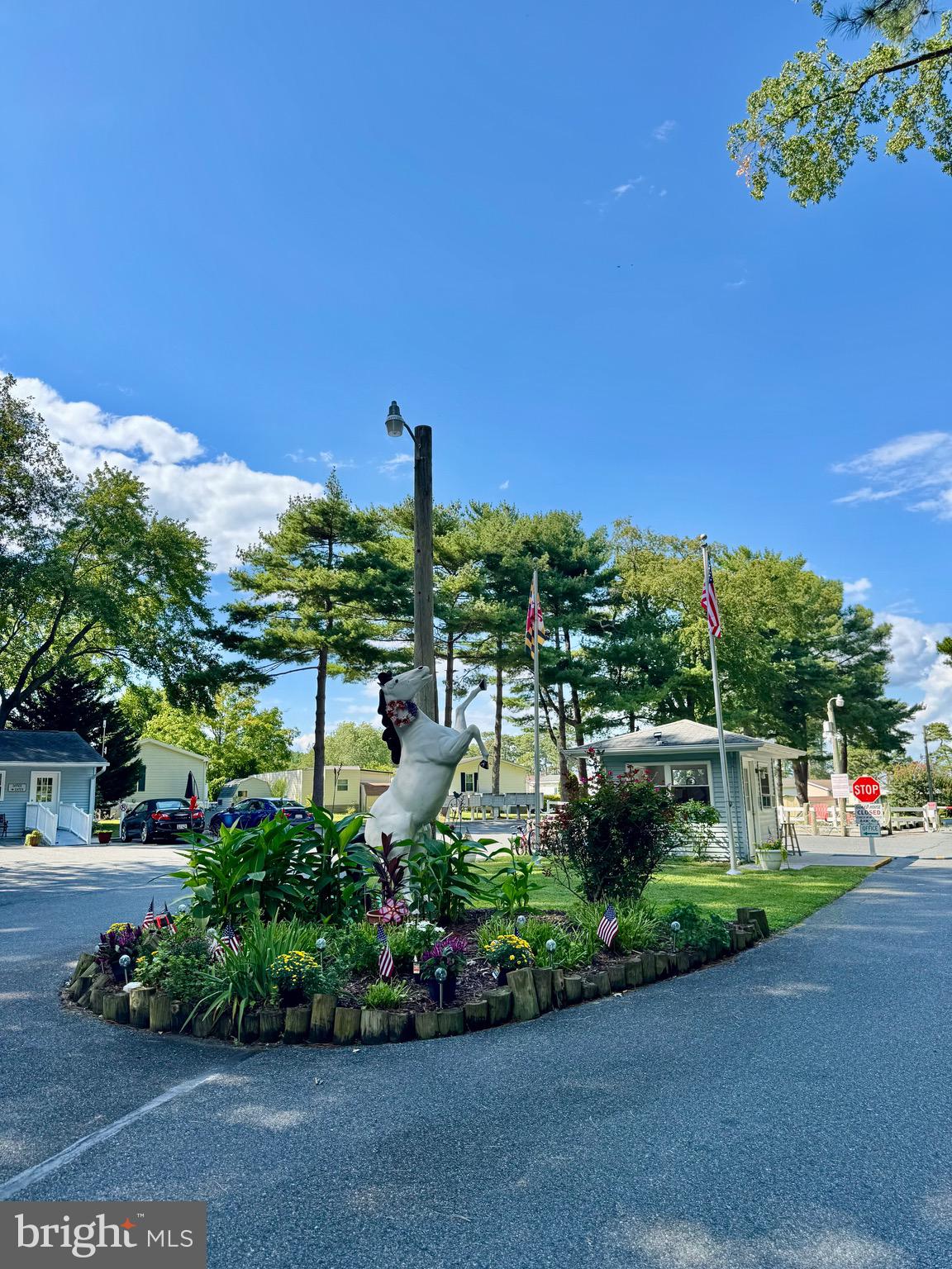 289 Woodhaven Court Berlin, MD 21811 - Photo 4 of 16 a view of a garden with a building in the background