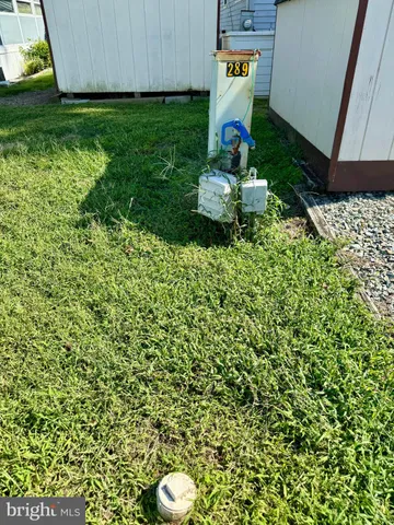 a view of a lake with houses in back